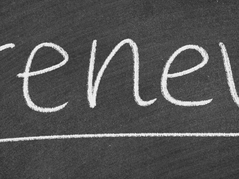 Chalkboard with the word 'review' written in white chalk and an underline beneath it.